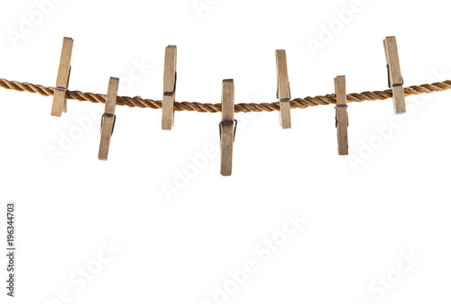 wooden clothespins on a rope isolated on a white background