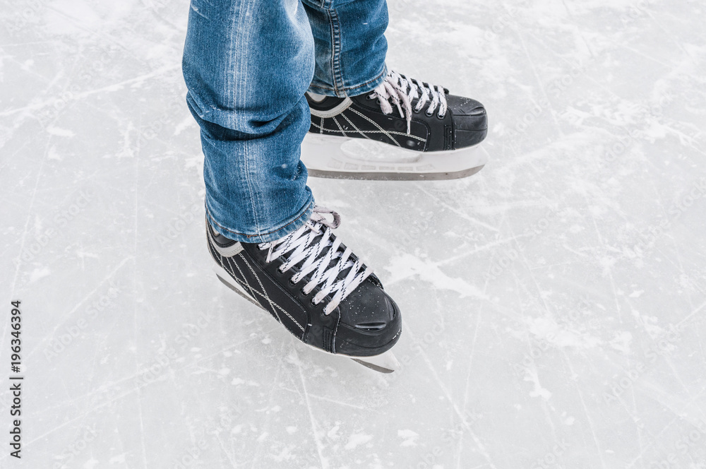 Man legs in ice skates Man legs in ice skates