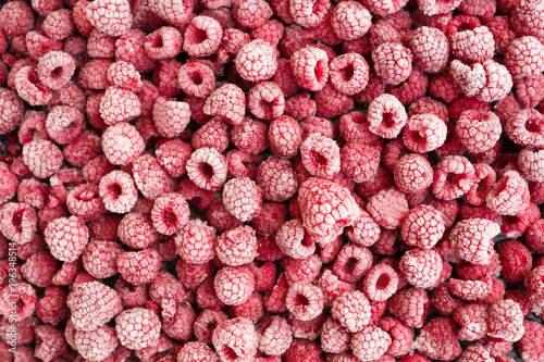 Ripe frozen raspberries top view.