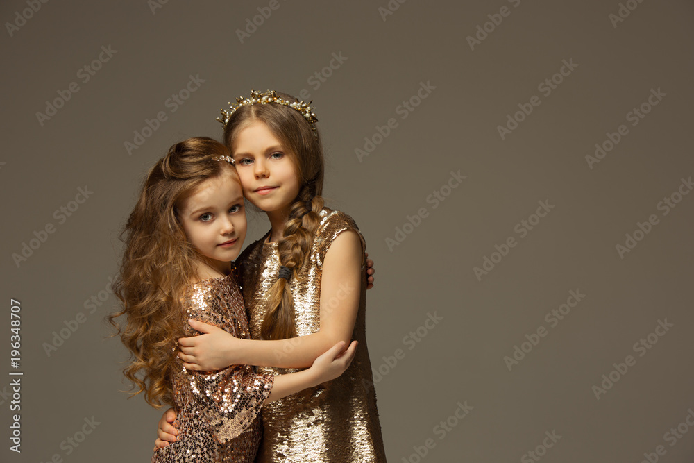 The fashion portrait of young beautiful teen girls at studio The fashion portrait of young beautiful teen girls at studio