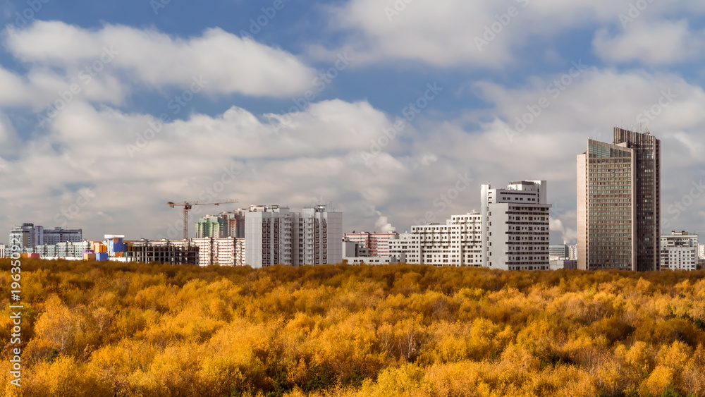 October 2017, Moscow, Russia - aerial view of modern high rise residential buildings surrounded by autumn pak