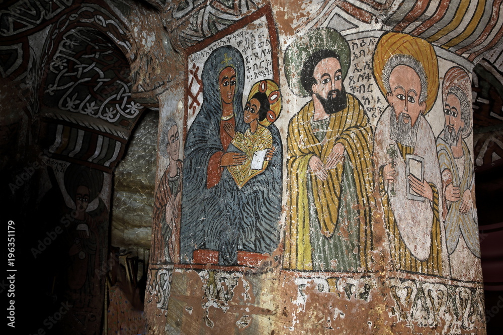 : iconographic scenes and wall murals of saints painted in naive african christian style in Abuna Yemata Guh church  