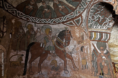 : iconographic scenes and wall murals of saints painted in naive african christian style in Abuna Yemata Guh church   photo