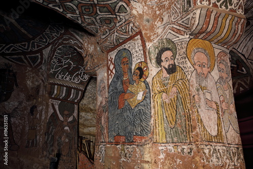 : iconographic scenes and wall murals of saints painted in naive african christian style in Abuna Yemata Guh church  