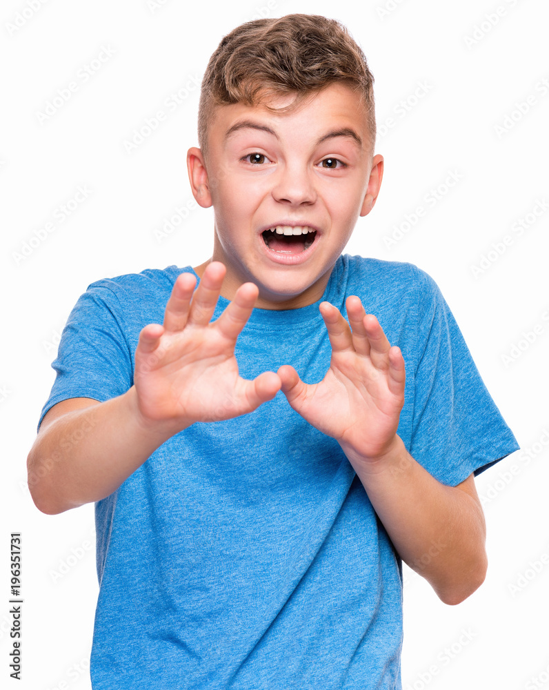 Emotional portrait of caucasian teen boy wearing blue tshirt