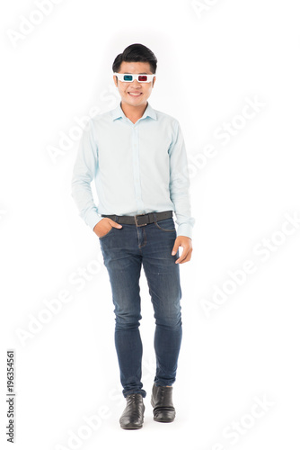 Portrait of young Asian man wearing 3d cinema glasses on white background