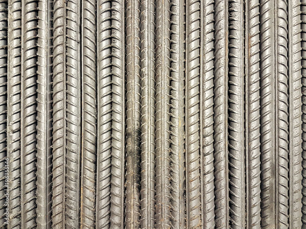 Fototapeta premium stack of ribbed steel bars for construction. top view