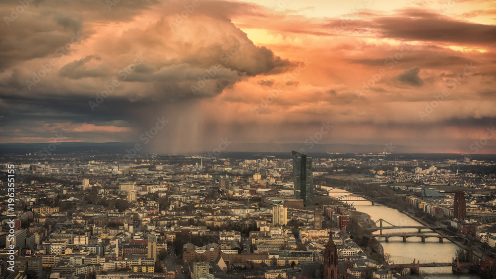An impressive weather cell dumps its rain over Frankfurt am Main. Concept: weather and cityscape