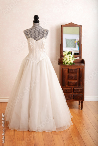 tulle wedding dress with straps on a mannequin