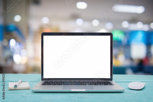 Laptop with blank screen on table of hospital background, Patient sitting chair with waiting seat for see doctor