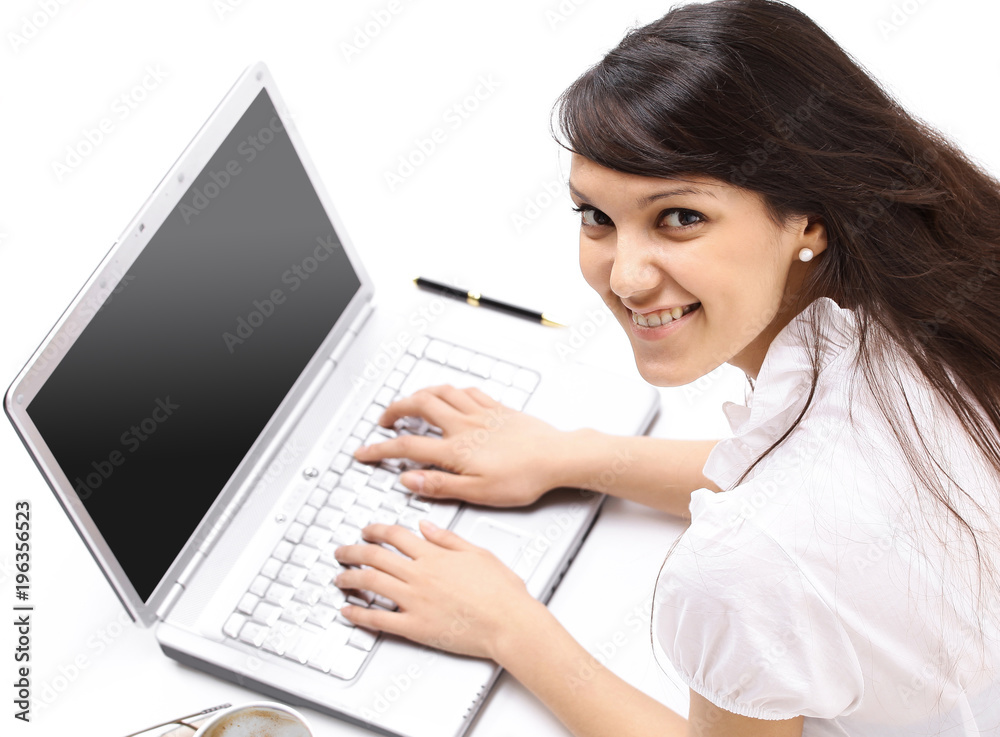 closeup.young woman working on laptop. the view from the top closeup.young woman working on laptop. the view from the top