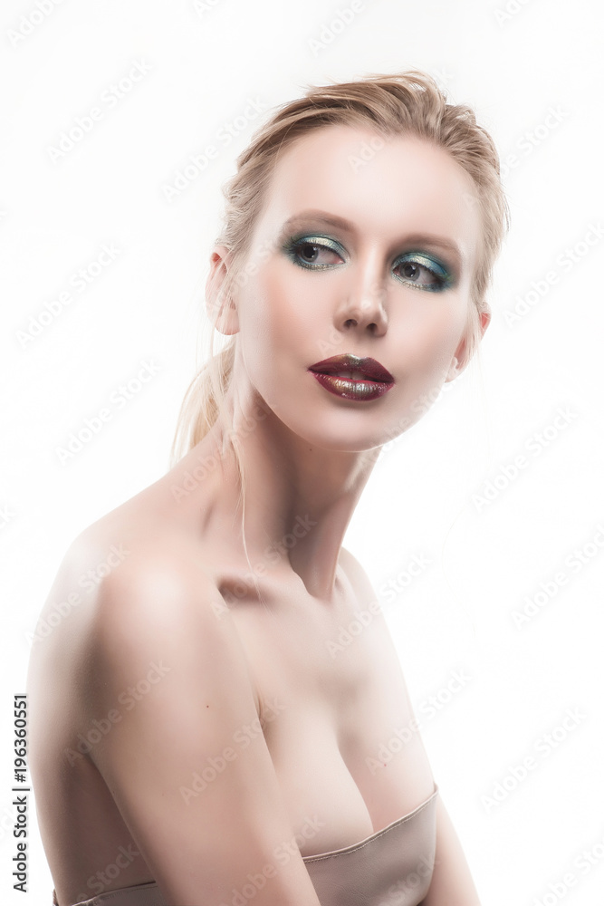 Portrait of beautiful young blond woman with clean face. High key shot.