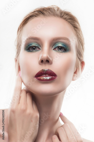 Portrait of beautiful young blond woman with clean face. High key shot.