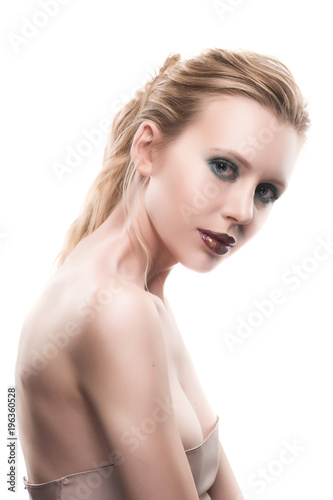 Portrait of beautiful young blond woman with clean face. High key shot.