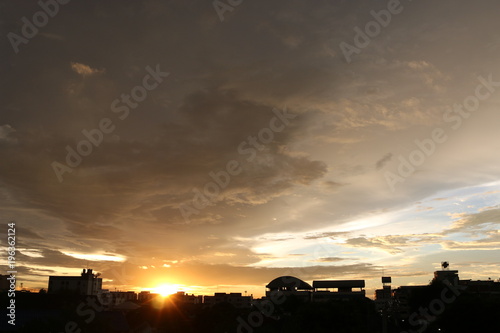 sunset and big black clouds in sky before rain in city  beautiful sunset city landscape   romantic screen