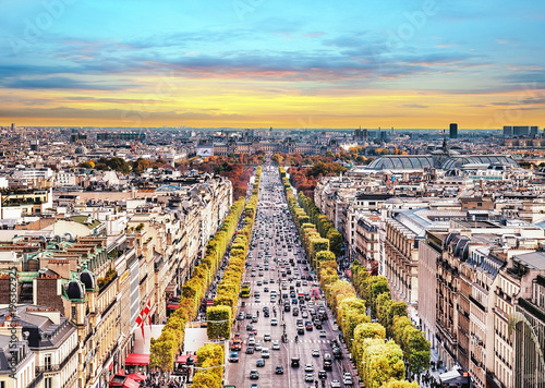 Fototapeta Naklejka Na Ścianę i Meble -  Paris, France - Champs Elysees cityscape. View from Arc de Triomphe. Sunset sky with clouds in autumn.