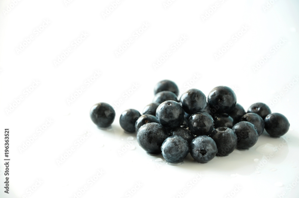 Fresh Blueberries on White Background with Copyspace Fresh Blueberries on White Background with Copyspace