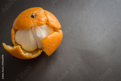 Garlic in a tangerine skin. photo