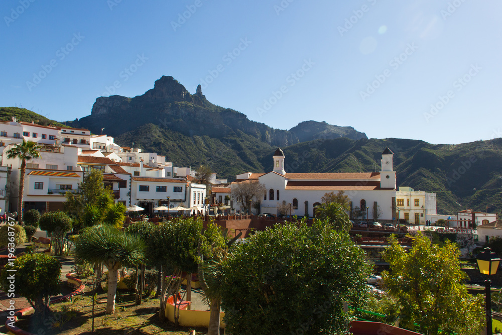 Great views of Tejeda old town with Roque Nublo mountain on the background in Gran Canaria, Spain. Sunny day on iconic tourist destination. Summer vacation tour visit concept