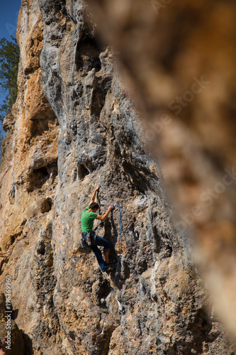  rock-climber climbs route with lower insurance  