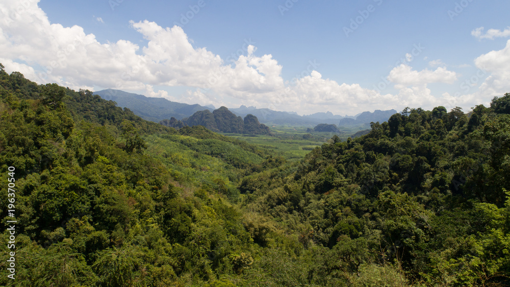 Aerial view of tropical green rain forest landscape in Thailand during sunny summer day Aerial view of tropical green rain forest landscape in Thailand during sunny summer day