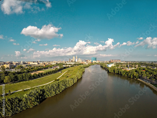 Drone image over the white river in Indianapolis with skyline