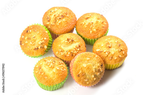 Fresh homemade delicious muffins,cupcake,banana cake with dried nuts isolated on white background.