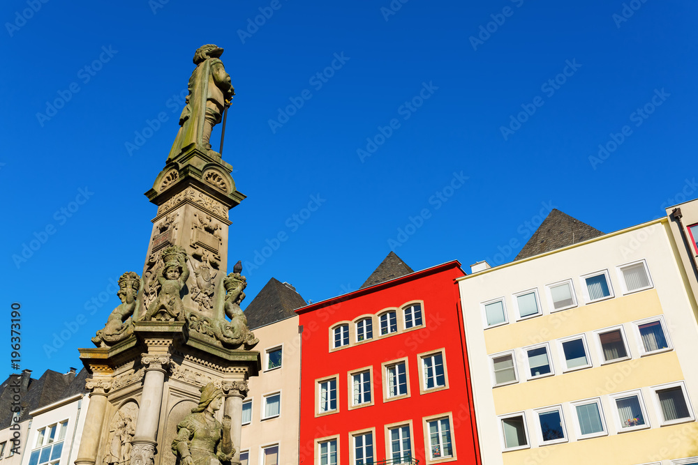 historic monument of a fountain on the old market square in Cologne, Germany