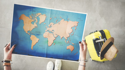 Woman holding world map travel concept