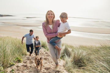 Family Walking Up a Sand Dune