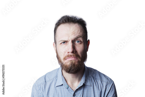 Face of an angry and furious male on a white background.