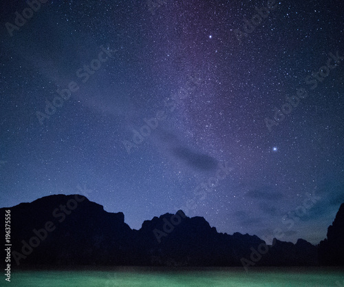 Stars and night sky over lake background