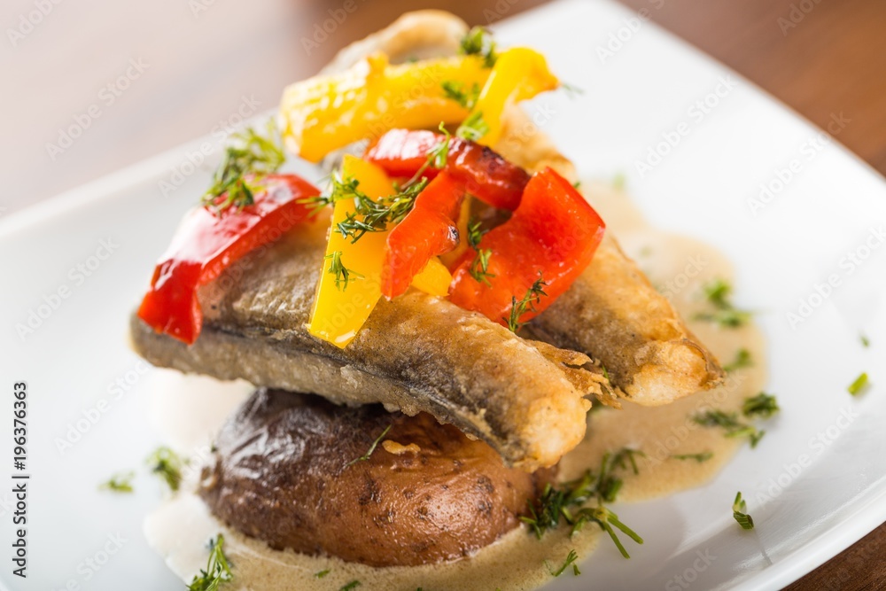 Grilled Sardines Plate with Potatoes Decorated by Pepper Grilled Sardines Plate with Potatoes Decorated by Pepper