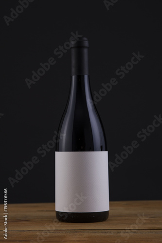 Isolated Red Wine Bottle in a Black Background