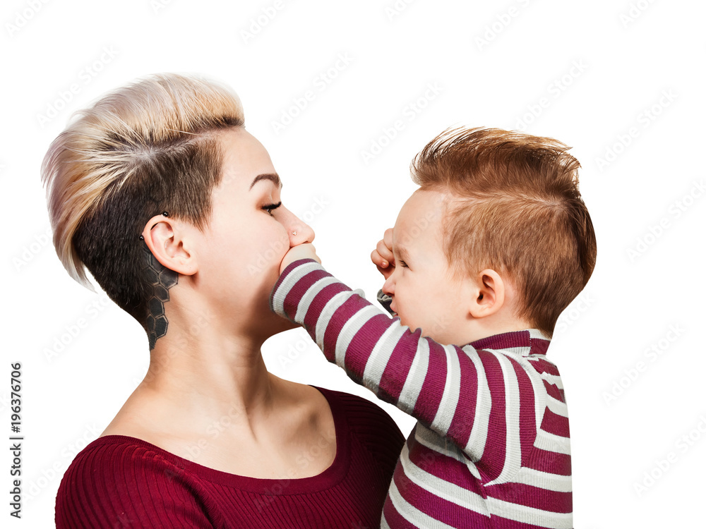 Extraordinary mother with baby boy on hands with hairstyle smiling, isolated on white. Little baby boy playing with mom and closing her mouth. Stock Photo | Adobe Stock Extraordinary mother with baby boy on hands with hairstyle smiling, isolated on white. Little baby boy playing with mom and closing her mouth. Stock Photo | Adobe Stock