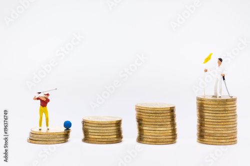 Miniature people : Businessmen spend their free time for Golf activities. Image use for sport, hobbies concept.