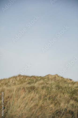 Sand Dune Against a Blue Sky