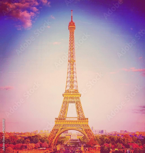 View of the Eiffel tower on a bright sunny day. Famous tourist place. Background with retro vintage instagram filter