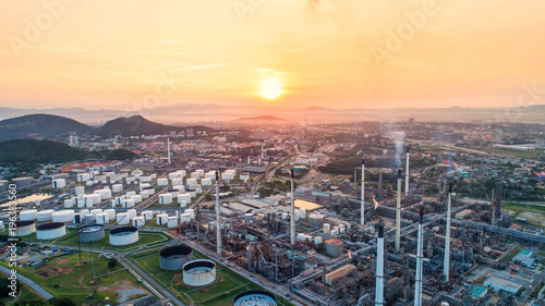 Aerial view Oil refinery with a background of mountains and sky.