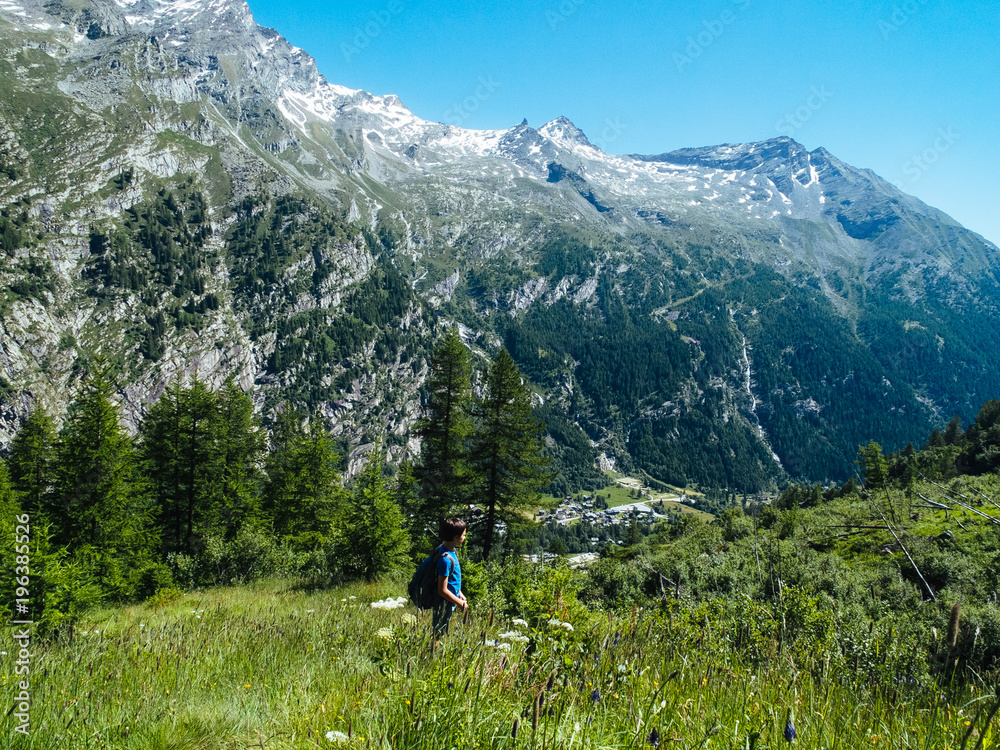 child during a mountain hike in the summer in the Alps, Monte Rosa