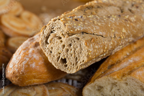 Cut wholegrain baguette with bakery products