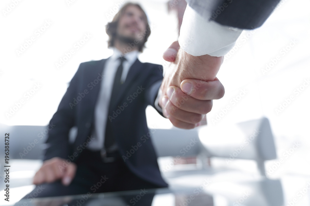 Close-up of two business people shaking hands Close-up of two business people shaking hands