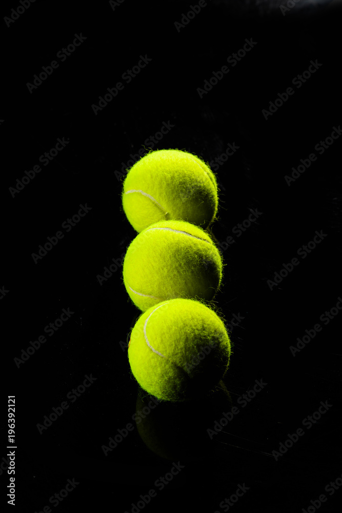 Tennis Ball isolated on black with dramatic lighting