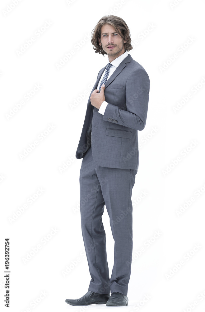 businessman straightening his tie isolated on a white background businessman straightening his tie isolated on a white background