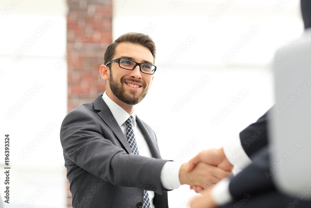 Two business colleagues shaking hands during meeting. Two business colleagues shaking hands during meeting.