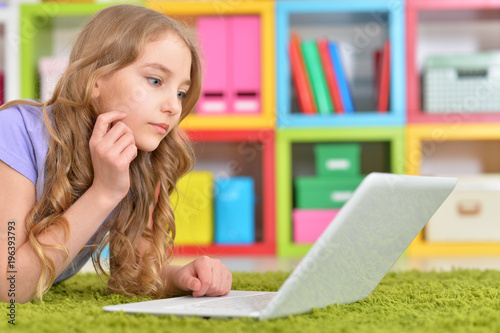 Teenage girl using a laptop