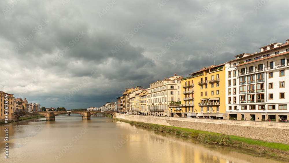 Arno river in Florence on a cloudy day in autumn