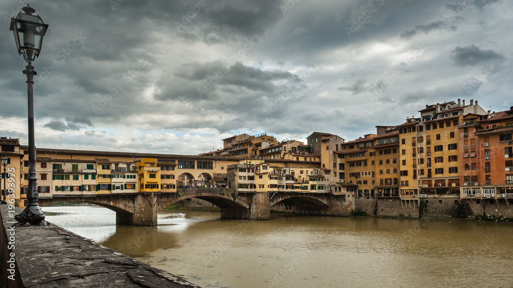 Bridge Ponte Vecchio in Florence on a cloudy day in autumn
