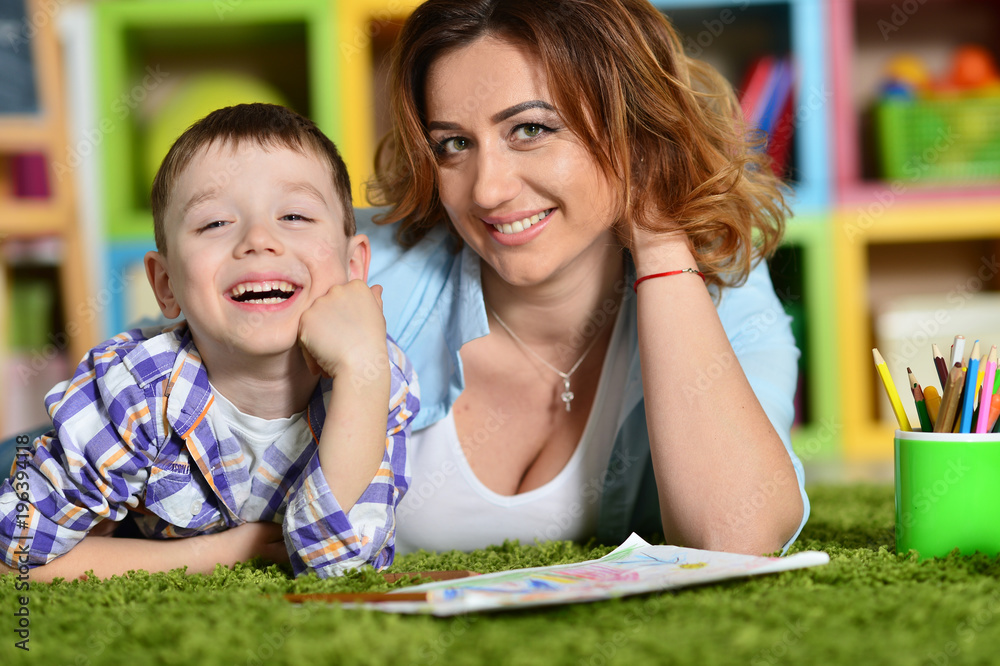 Mother and son painting together 