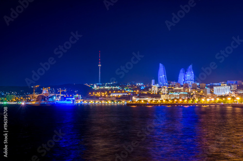 Baku downtown and flame towers at night © dinozzaver